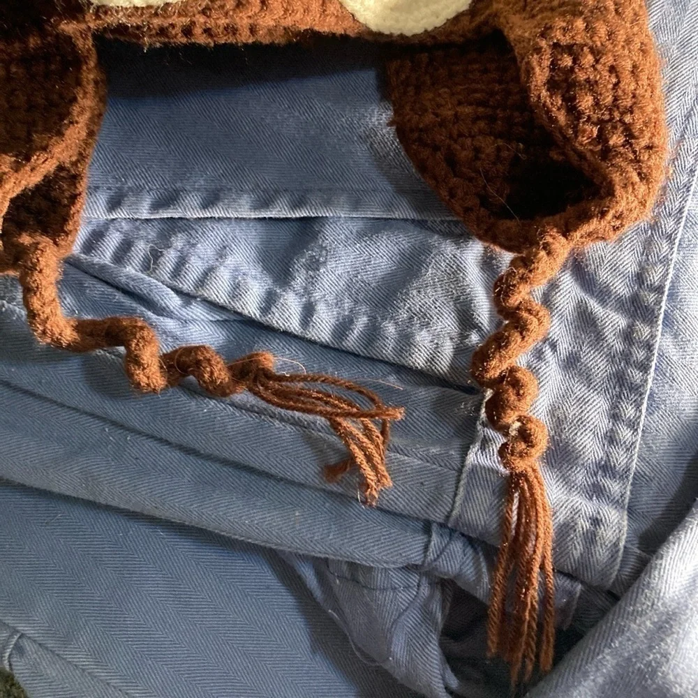 Crochet cat hat with ear flaps      New                 there’s a cat in my lap
